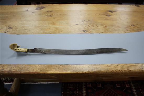 A Turkish sword Yataghan, with silver inlaid decoration and inscription, ivory grips, overall length 72cm